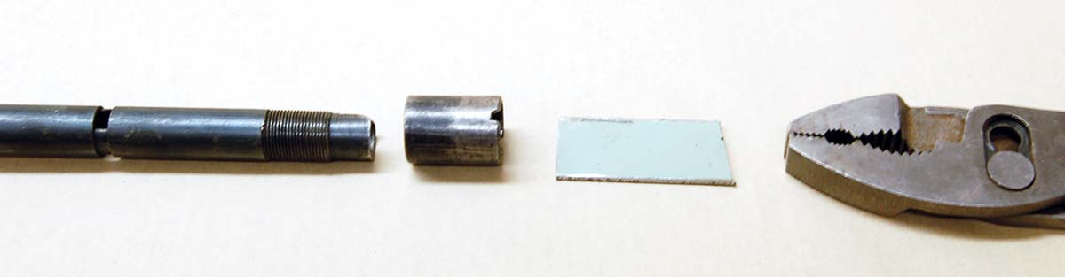 The outer tube of the buttstock magazine (left) acts as an anchor for the M24 stock. A piece of sheet metal fits in the magazine tube nut-screw slot (center) and pliers turn the nut out.